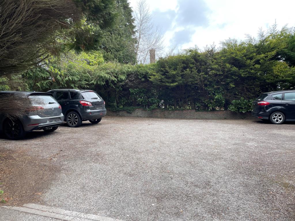 Lot: 36 - TWO-BEDROOM GROUND FLOOR FLAT WITH PARKING - View of car park with road access